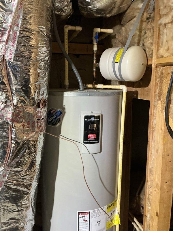 Performed site assessment of failed water heater installation in attic utility space. Documented rusted-out water heater unit requiring full replacement. Evaluated existing plumbing configuration including expansion tank, copper supply lines, and shut-off valves for compatibility with new equipment installation. Provided comprehensive estimate for water filtration system to address water quality issues contributing to premature tank failure and extend service life of replacement unit. Performed site assessment of failed water heater installation in attic utility space. Documented rusted-out water heater unit requiring full replacement. Evaluated existing plumbing configuration including expansion tank, copper supply lines, and shut-off valves for compatibility with new equipment installation. Provided comprehensive estimate for water filtration system to address water quality issues contributing to premature tank failure and extend service life of replacement unit.
