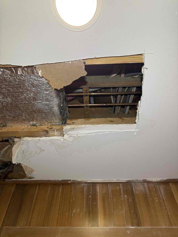 Responded to ceiling leak with visible water damage and structural compromise. Performed exploratory access by opening ceiling and wall sections to locate source of water intrusion and assess extent of damage to framing, insulation, and building materials. Documented conditions showing water staining, compromised drywall, and exposed structural components for repair planning and remediation. Responded to ceiling leak with visible water damage and structural compromise. Performed exploratory access by opening ceiling and wall sections to locate source of water intrusion and assess extent of damage to framing, insulation, and building materials. Documented conditions showing water staining, compromised drywall, and exposed structural components for repair planning and remediation.