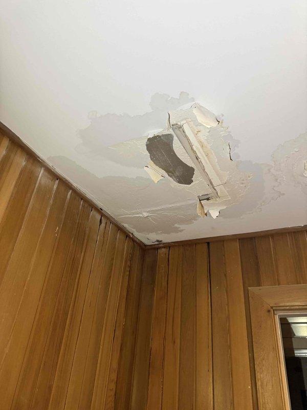 Responded to ceiling leak with visible water damage and structural compromise. Performed exploratory access by opening ceiling and wall sections to locate source of water intrusion and assess extent of damage to framing, insulation, and building materials. Documented conditions showing water staining, compromised drywall, and exposed structural components for repair planning and remediation. Responded to ceiling leak with visible water damage and structural compromise. Performed exploratory access by opening ceiling and wall sections to locate source of water intrusion and assess extent of damage to framing, insulation, and building materials. Documented conditions showing water staining, compromised drywall, and exposed structural components for repair planning and remediation.