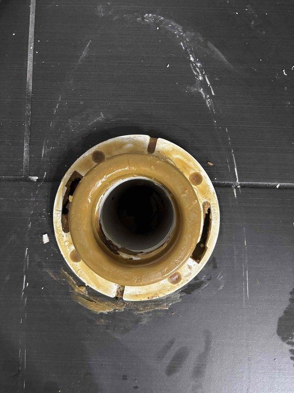 Responded to report of water leaking in basement near tankless water heater and whole home filtration system. Upon inspection, identified a corroded floor drain fixture showing significant rust and deterioration around the bolt holes and flange assembly. The drain exhibited signs of long-term moisture exposure and structural compromise, which was determined to be the primary source of the water infiltration issue. Documented conditions with photographs for customer records and recommended immediate repair or replacement of the failed drain fixture to prevent further water damage to the basement area. Responded to report of water leaking in basement near tankless water heater and whole home filtration system. Upon inspection, identified a corroded floor drain fixture showing significant rust and deterioration around the bolt holes and flange assembly. The drain exhibited signs of long-term moisture exposure and structural compromise, which was determined to be the primary source of the water infiltration issue. Documented conditions with photographs for customer records and recommended immediate repair or replacement of the failed drain fixture to prevent further water damage to the basement area.