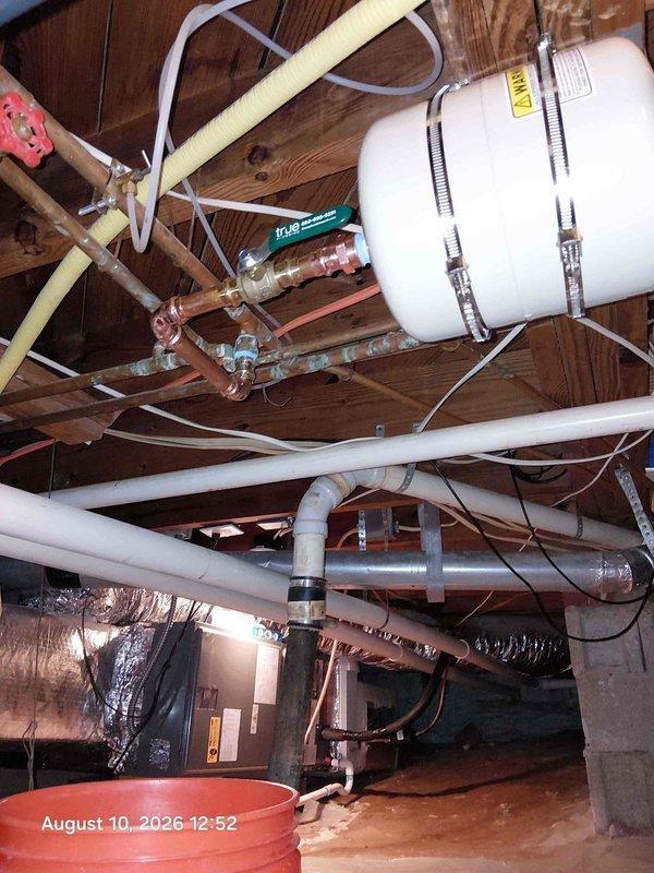 Completed tankless water heater replacement at residential property. Removed existing unit and installed new tankless water heater system with proper venting, gas line connections, and water supply integration. Installed pressure tank with copper piping, brass valves, and appropriate mounting hardware secured to floor joists. Configured electrical connections with proper wiring and control systems. Applied pipe insulation to water lines and verified all connections for proper operation and code compliance. Completed tankless water heater replacement at residential property. Removed existing unit and installed new tankless water heater system with proper venting, gas line connections, and water supply integration. Installed pressure tank with copper piping, brass valves, and appropriate mounting hardware secured to floor joists. Configured electrical connections with proper wiring and control systems. Applied pipe insulation to water lines and verified all connections for proper operation and code compliance.