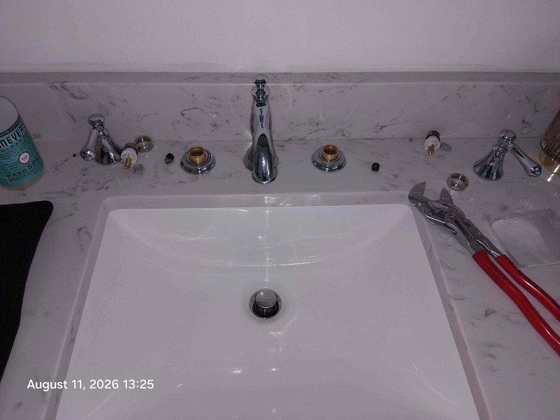 Responded to service call for leaking Delta faucets in kitchen and master bathroom. Kitchen faucet required RP73000 cartridge replacement after customer's attempted repair was unsuccessful. Master bathroom faucet was disassembled, rebuilt with new internal components, and reassembled with chrome spout and brass-accented handles. Both fixtures were tested for proper operation and verified leak-free upon completion. Responded to service call for leaking Delta faucets in kitchen and master bathroom. Kitchen faucet required RP73000 cartridge replacement after customer's attempted repair was unsuccessful. Master bathroom faucet was disassembled, rebuilt with new internal components, and reassembled with chrome spout and brass-accented handles. Both fixtures were tested for proper operation and verified leak-free upon completion.
