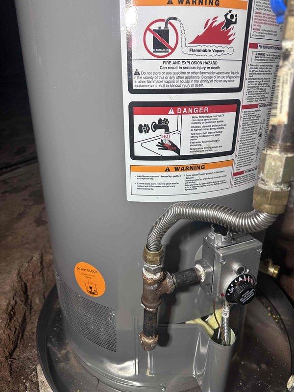 Responded to service call for gas water heater with confirmed ignitor failure. Upon arrival, verified gas supply was present and inspected the unit's control assembly and ignition system. Diagnosed faulty ignitor preventing burner operation. Documented existing installation conditions including gas line connections, control valve assembly, and overall unit configuration through photographic evidence for service records. Responded to service call for gas water heater with confirmed ignitor failure. Upon arrival, verified gas supply was present and inspected the unit's control assembly and ignition system. Diagnosed faulty ignitor preventing burner operation. Documented existing installation conditions including gas line connections, control valve assembly, and overall unit configuration through photographic evidence for service records.