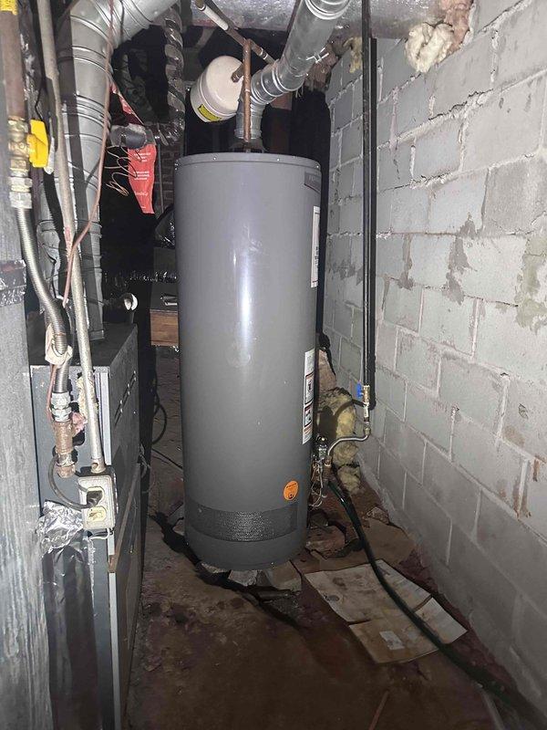 Responded to service call for gas water heater with confirmed ignitor failure. Upon arrival, verified gas supply was present and inspected the unit's control assembly and ignition system. Diagnosed faulty ignitor preventing burner operation. Documented existing installation conditions including gas line connections, control valve assembly, and overall unit configuration through photographic evidence for service records. Responded to service call for gas water heater with confirmed ignitor failure. Upon arrival, verified gas supply was present and inspected the unit's control assembly and ignition system. Diagnosed faulty ignitor preventing burner operation. Documented existing installation conditions including gas line connections, control valve assembly, and overall unit configuration through photographic evidence for service records.