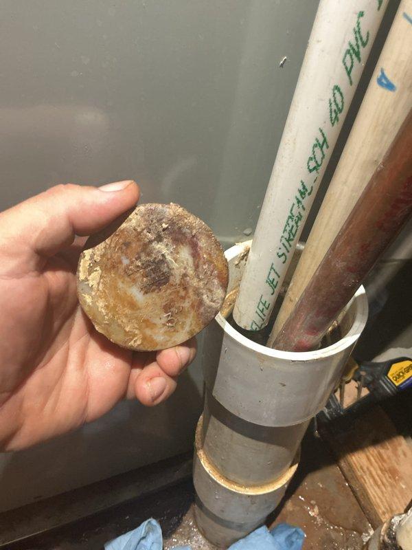 Responded to clogged hub drain in mechanical room and investigated ceiling leak. Upon inspection, discovered severe mineral buildup and corrosion restricting flow through the drain line. Cut and removed section of PVC pipe showing significant internal deterioration with calcium deposits narrowing the passage. Documented existing plumbing conditions including corroded copper piping. Discussed option to cap off steam shower unit to address ongoing leak issue. Responded to clogged hub drain in mechanical room and investigated ceiling leak. Upon inspection, discovered severe mineral buildup and corrosion restricting flow through the drain line. Cut and removed section of PVC pipe showing significant internal deterioration with calcium deposits narrowing the passage. Documented existing plumbing conditions including corroded copper piping. Discussed option to cap off steam shower unit to address ongoing leak issue.