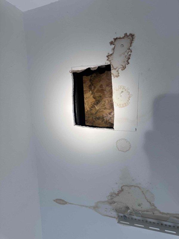 Responded to service call for leak detection and repair. Located active water leak in attic space causing moisture intrusion through ceiling and interior wall damage. Accessed crawl space to identify source of leak, documented extensive water staining and deteriorated drywall with visible moisture penetration. Cut access opening in affected wall to expose underlying damage and assess extent of water infiltration. Leak source identified and repaired to prevent further water damage to structure. Responded to service call for leak detection and repair. Located active water leak in attic space causing moisture intrusion through ceiling and interior wall damage. Accessed crawl space to identify source of leak, documented extensive water staining and deteriorated drywall with visible moisture penetration. Cut access opening in affected wall to expose underlying damage and assess extent of water infiltration. Leak source identified and repaired to prevent further water damage to structure.