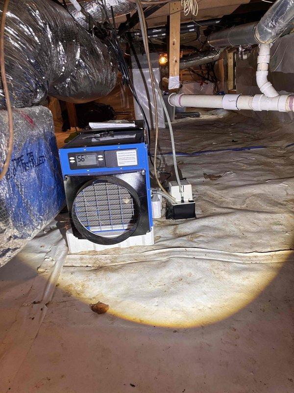 Completed comprehensive inspection of four-unit HVAC system including two central air units and two mini-split systems. Accessed crawl space to evaluate dehumidification equipment and ductwork integrity, confirming proper operation of installed dehumidifier unit and inspecting vapor barrier condition. Examined flexible ductwork and PVC condensate lines for proper support and routing. Inspected electrical control panel and capacitor connections on outdoor condensing unit, verifying wire terminations and component mounting. All systems found operating within normal parameters with no immediate service needs identified. Completed comprehensive inspection of four-unit HVAC system including two central air units and two mini-split systems. Accessed crawl space to evaluate dehumidification equipment and ductwork integrity, confirming proper operation of installed dehumidifier unit and inspecting vapor barrier condition. Examined flexible ductwork and PVC condensate lines for proper support and routing. Inspected electrical control panel and capacitor connections on outdoor condensing unit, verifying wire terminations and component mounting. All systems found operating within normal parameters with no immediate service needs identified.