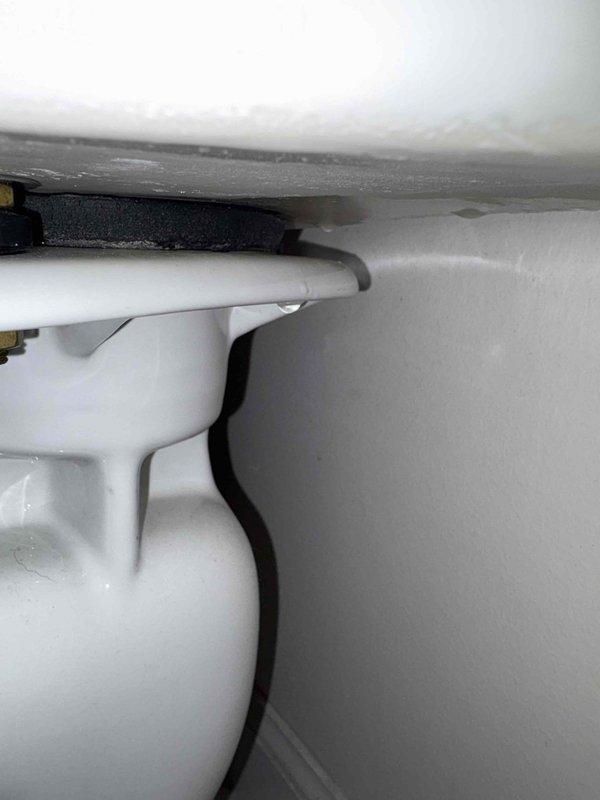 Responded to service call for reported broken toilet seal. Upon inspection, identified failed wax ring seal at toilet base causing water leakage. Removed toilet from floor flange, scraped and cleaned old wax ring residue from both flange and toilet base. Installed new wax ring seal and properly reset toilet onto flange, ensuring level positioning. Tightened closet bolts to manufacturer specifications and reconnected water supply line. Tested flush mechanism multiple times to verify proper seal and confirm no leakage at base. Documented repair with photographs for service records. Responded to service call for reported broken toilet seal. Upon inspection, identified failed wax ring seal at toilet base causing water leakage. Removed toilet from floor flange, scraped and cleaned old wax ring residue from both flange and toilet base. Installed new wax ring seal and properly reset toilet onto flange, ensuring level positioning. Tightened closet bolts to manufacturer specifications and reconnected water supply line. Tested flush mechanism multiple times to verify proper seal and confirm no leakage at base. Documented repair with photographs for service records.