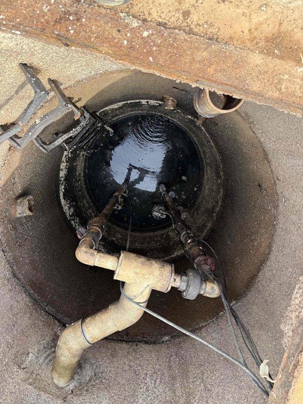 Responded to septic pit overflow caused by dual pump failure. Upon inspection, found standing water in access pit with both sewage pumps inoperative. Assessed plumbing configuration including PVC piping and metal components within pit. Identified non-functioning pump system requiring replacement or repair to restore proper drainage and prevent continued overflow conditions. Responded to septic pit overflow caused by dual pump failure. Upon inspection, found standing water in access pit with both sewage pumps inoperative. Assessed plumbing configuration including PVC piping and metal components within pit. Identified non-functioning pump system requiring replacement or repair to restore proper drainage and prevent continued overflow conditions.