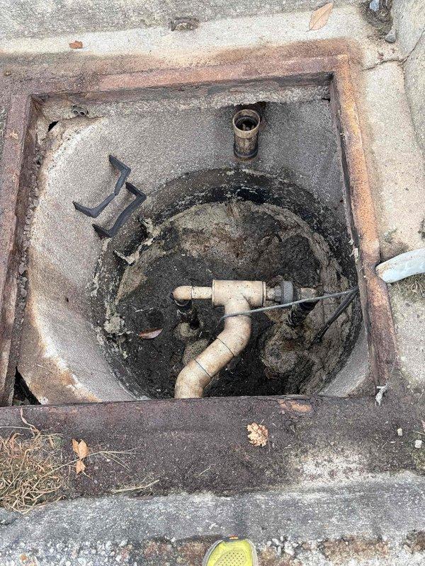 Responded to septic pit overflow caused by dual pump failure. Upon inspection, found standing water in access pit with both sewage pumps inoperative. Assessed plumbing configuration including PVC piping and metal components within pit. Identified non-functioning pump system requiring replacement or repair to restore proper drainage and prevent continued overflow conditions. Responded to septic pit overflow caused by dual pump failure. Upon inspection, found standing water in access pit with both sewage pumps inoperative. Assessed plumbing configuration including PVC piping and metal components within pit. Identified non-functioning pump system requiring replacement or repair to restore proper drainage and prevent continued overflow conditions.