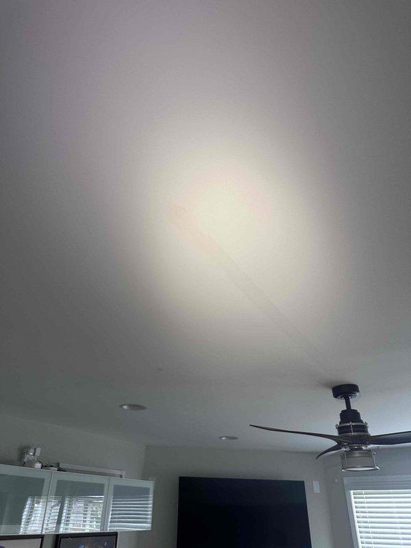 Responded to report of water leak from master bathroom penetrating living room ceiling below. Upon arrival, performed visual inspection of affected ceiling area and utilized electronic moisture detection equipment to scan and identify extent of water intrusion in ceiling material. Documented conditions with photographs showing water staining and moisture presence on ceiling surface near ceiling fan fixture. Detection device readings confirmed elevated moisture levels in ceiling drywall, indicating active leak from plumbing fixtures or drain lines in master bathroom above. Identified leak source location and documented findings for necessary repairs to plumbing system and subsequent ceiling restoration. Responded to report of water leak from master bathroom penetrating living room ceiling below. Upon arrival, performed visual inspection of affected ceiling area and utilized electronic moisture detection equipment to scan and identify extent of water intrusion in ceiling material. Documented conditions with photographs showing water staining and moisture presence on ceiling surface near ceiling fan fixture. Detection device readings confirmed elevated moisture levels in ceiling drywall, indicating active leak from plumbing fixtures or drain lines in master bathroom above. Identified leak source location and documented findings for necessary repairs to plumbing system and subsequent ceiling restoration.