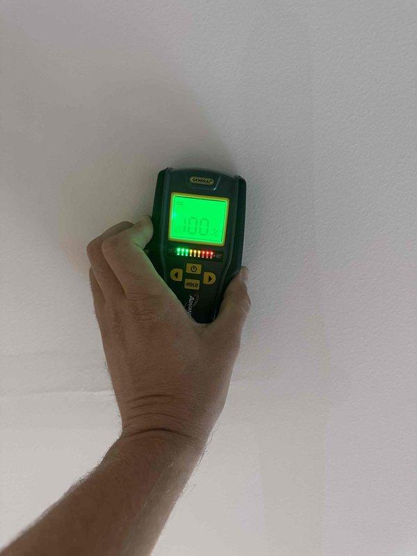 Responded to report of water leak from master bathroom penetrating living room ceiling below. Upon arrival, performed visual inspection of affected ceiling area and utilized electronic moisture detection equipment to scan and identify extent of water intrusion in ceiling material. Documented conditions with photographs showing water staining and moisture presence on ceiling surface near ceiling fan fixture. Detection device readings confirmed elevated moisture levels in ceiling drywall, indicating active leak from plumbing fixtures or drain lines in master bathroom above. Identified leak source location and documented findings for necessary repairs to plumbing system and subsequent ceiling restoration. Responded to report of water leak from master bathroom penetrating living room ceiling below. Upon arrival, performed visual inspection of affected ceiling area and utilized electronic moisture detection equipment to scan and identify extent of water intrusion in ceiling material. Documented conditions with photographs showing water staining and moisture presence on ceiling surface near ceiling fan fixture. Detection device readings confirmed elevated moisture levels in ceiling drywall, indicating active leak from plumbing fixtures or drain lines in master bathroom above. Identified leak source location and documented findings for necessary repairs to plumbing system and subsequent ceiling restoration.