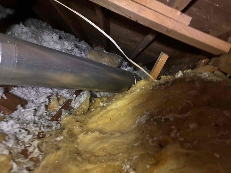 Replaced furnace vent pipe to common connector in residential basement utility area. Navigated attic crawl space with loose-fill insulation to access existing ductwork, removed deteriorated venting, and installed new metallic vent pipe with proper elbow joint connections to ensure safe exhaust ventilation from furnace to common venting system. Replaced furnace vent pipe to common connector in residential basement utility area. Navigated attic crawl space with loose-fill insulation to access existing ductwork, removed deteriorated venting, and installed new metallic vent pipe with proper elbow joint connections to ensure safe exhaust ventilation from furnace to common venting system.
