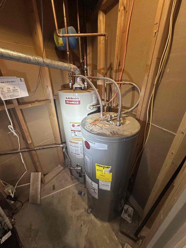 Responded to request for water heater replacement quote on aging standard tank unit. Inspected existing A.O. Smith ProMax water heater installation in unfinished basement utility area, evaluated all connections including copper supply lines, expansion tank mounting, and associated plumbing infrastructure. Documented current equipment condition and configuration with photos to provide accurate replacement estimate, noting proper clearances and existing pipe routing for new installation planning. Responded to request for water heater replacement quote on aging standard tank unit. Inspected existing A.O. Smith ProMax water heater installation in unfinished basement utility area, evaluated all connections including copper supply lines, expansion tank mounting, and associated plumbing infrastructure. Documented current equipment condition and configuration with photos to provide accurate replacement estimate, noting proper clearances and existing pipe routing for new installation planning.