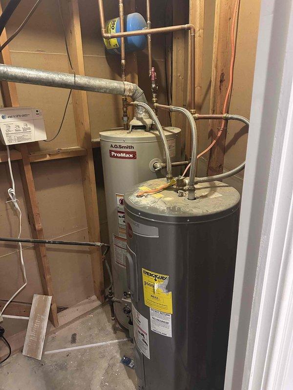 Responded to request for water heater replacement quote on aging standard tank unit. Inspected existing A.O. Smith ProMax water heater installation in unfinished basement utility area, evaluated all connections including copper supply lines, expansion tank mounting, and associated plumbing infrastructure. Documented current equipment condition and configuration with photos to provide accurate replacement estimate, noting proper clearances and existing pipe routing for new installation planning. Responded to request for water heater replacement quote on aging standard tank unit. Inspected existing A.O. Smith ProMax water heater installation in unfinished basement utility area, evaluated all connections including copper supply lines, expansion tank mounting, and associated plumbing infrastructure. Documented current equipment condition and configuration with photos to provide accurate replacement estimate, noting proper clearances and existing pipe routing for new installation planning.