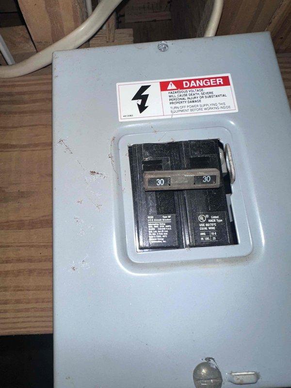 Responded to follow-up service call for ongoing hot water issue. Inspected electrical panel serving water heating equipment and documented current breaker configuration. Panel contains dual 30-amp double-pole breakers with visible wear and rust on enclosure. Verified breaker positions and captured detailed photos of panel interior, breaker labels, and circuit identification for further diagnostic evaluation and potential electrical system upgrades. Responded to follow-up service call for ongoing hot water issue. Inspected electrical panel serving water heating equipment and documented current breaker configuration. Panel contains dual 30-amp double-pole breakers with visible wear and rust on enclosure. Verified breaker positions and captured detailed photos of panel interior, breaker labels, and circuit identification for further diagnostic evaluation and potential electrical system upgrades.