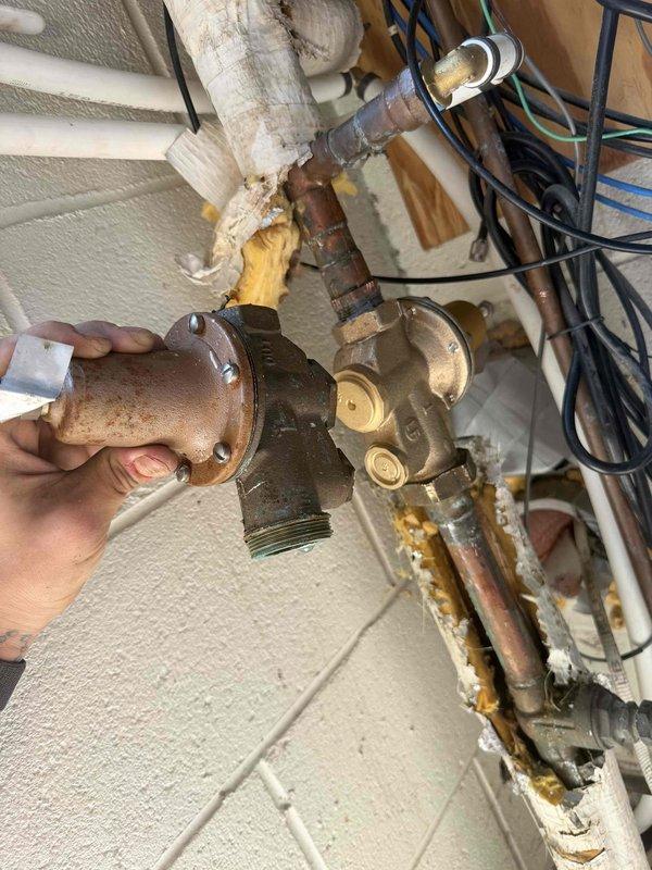 Replaced heavily corroded pressure reducing valve (PRV) with new unit. The original valve exhibited extensive rust deposits and oxidation throughout the assembly, compromising system performance and reliability. Installed replacement PRV with new pressure gauge, verified proper system pressure settings, and confirmed all connections were secure and leak-free upon completion. Replaced heavily corroded pressure reducing valve (PRV) with new unit. The original valve exhibited extensive rust deposits and oxidation throughout the assembly, compromising system performance and reliability. Installed replacement PRV with new pressure gauge, verified proper system pressure settings, and confirmed all connections were secure and leak-free upon completion.