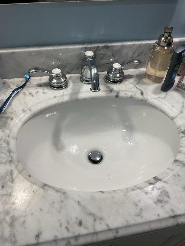 Responded to slow drainage issue affecting two second-floor sinks. Inspected bathroom vanity sink with undermount basin and chrome fixtures, as well as bathtub drain assembly where hardware was lodged in the drain mechanism. Removed obstructed drain components, cleared accumulated debris and hair buildup from both fixtures, and restored proper drainage flow to both locations. Responded to slow drainage issue affecting two second-floor sinks. Inspected bathroom vanity sink with undermount basin and chrome fixtures, as well as bathtub drain assembly where hardware was lodged in the drain mechanism. Removed obstructed drain components, cleared accumulated debris and hair buildup from both fixtures, and restored proper drainage flow to both locations.