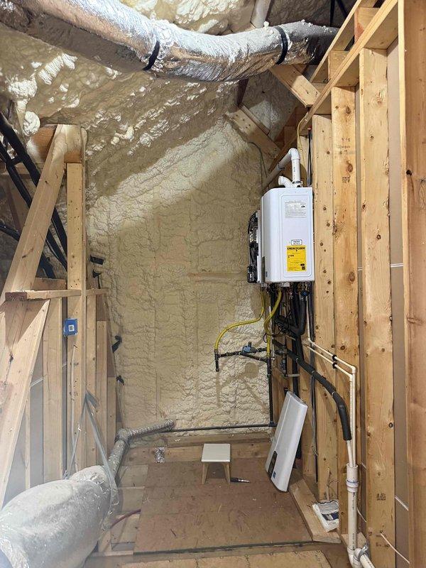 Responded to error code 003 on Navien tankless water heater. Inspected unit and associated components including gas lines, electrical connections, and plumbing fixtures in mechanical room during active construction phase. Verified proper installation of yellow flexible gas lines, copper supply piping with shut-off valves, and electrical panel connections to resolve intermittent operation issue requiring manual reset. Responded to error code 003 on Navien tankless water heater. Inspected unit and associated components including gas lines, electrical connections, and plumbing fixtures in mechanical room during active construction phase. Verified proper installation of yellow flexible gas lines, copper supply piping with shut-off valves, and electrical panel connections to resolve intermittent operation issue requiring manual reset.