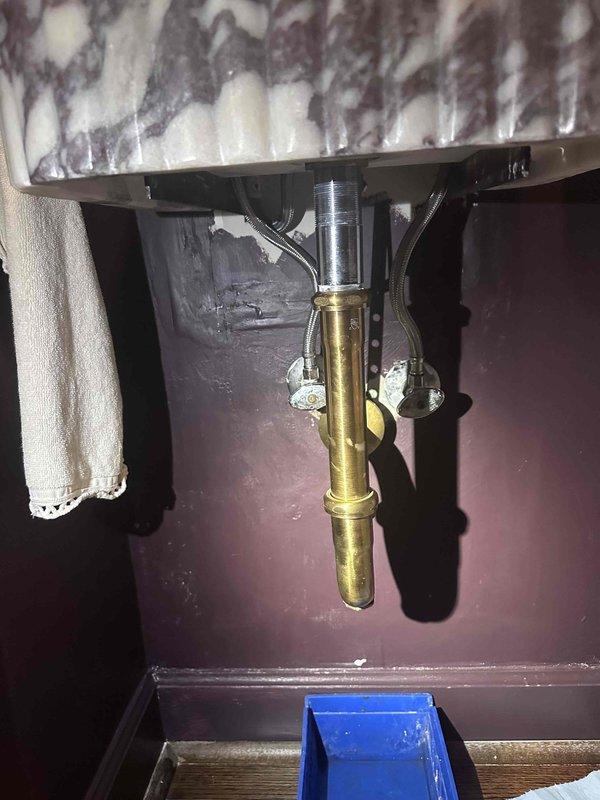 Responded to service call for leaking sink. Upon inspection, identified leak originating from drain assembly beneath bathroom vanity. Tightened chrome threaded fittings at sink basin connection and inspected brass drain pipe for proper seal. Verified all mounting brackets were secure and tested for additional leaks. System functioning properly with no active water discharge upon completion. Responded to service call for leaking sink. Upon inspection, identified leak originating from drain assembly beneath bathroom vanity. Tightened chrome threaded fittings at sink basin connection and inspected brass drain pipe for proper seal. Verified all mounting brackets were secure and tested for additional leaks. System functioning properly with no active water discharge upon completion.