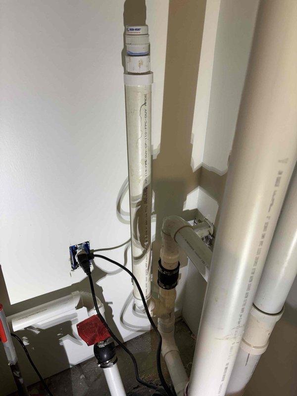 Responded to complaint of recurring sewer gas odor in basement area suspected to originate from sewage ejector pump system. Inspected plumbing installation including PVC drainage piping, water filtration system, and sewage pump assembly located in utility area. Examined pump connections, vent piping configuration, and pressure monitoring equipment to identify source of sewer gas intrusion. Verified proper operation of ejector pump and assessed integrity of trap seal and vent stack connections to eliminate odor issue. Responded to complaint of recurring sewer gas odor in basement area suspected to originate from sewage ejector pump system. Inspected plumbing installation including PVC drainage piping, water filtration system, and sewage pump assembly located in utility area. Examined pump connections, vent piping configuration, and pressure monitoring equipment to identify source of sewer gas intrusion. Verified proper operation of ejector pump and assessed integrity of trap seal and vent stack connections to eliminate odor issue.