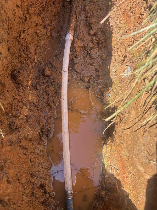 Completed water service line repair through hand excavation of trench in clay soil conditions. Exposed and replaced damaged section of water service pipe with new PVC piping and secure metal couplings, ensuring proper connection and alignment throughout the repair zone. Completed water service line repair through hand excavation of trench in clay soil conditions. Exposed and replaced damaged section of water service pipe with new PVC piping and secure metal couplings, ensuring proper connection and alignment throughout the repair zone.