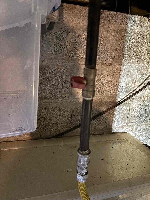 Responded to service call for water heater not producing hot water. Upon arrival, performed diagnostic inspection of the unit and associated components. Inspected gas supply line connections, pressure relief valve, and temperature-pressure gauge reading. Documented current system configuration including venting setup and gas line installation with flexible connector. Verified water supply connections and checked system pressure using installed gauge. Discussed findings with customer regarding existing estimate for power vent water heater replacement currently on file. Photographed current installation conditions showing gas line configuration with flexible yellow corrugated connector, pressure gauge mounted on unit displaying proper scale markings, and black vent pipe with red valve fitting. Advised customer of system status and confirmed awareness of pending replacement estimate for power vent unit conversion. Responded to service call for water heater not producing hot water. Upon arrival, performed diagnostic inspection of the unit and associated components. Inspected gas supply line connections, pressure relief valve, and temperature-pressure gauge reading. Documented current system configuration including venting setup and gas line installation with flexible connector. Verified water supply connections and checked system pressure using installed gauge. Discussed findings with customer regarding existing estimate for power vent water heater replacement currently on file. Photographed current installation conditions showing gas line configuration with flexible yellow corrugated connector, pressure gauge mounted on unit displaying proper scale markings, and black vent pipe with red valve fitting. Advised customer of system status and confirmed awareness of pending replacement estimate for power vent unit conversion.