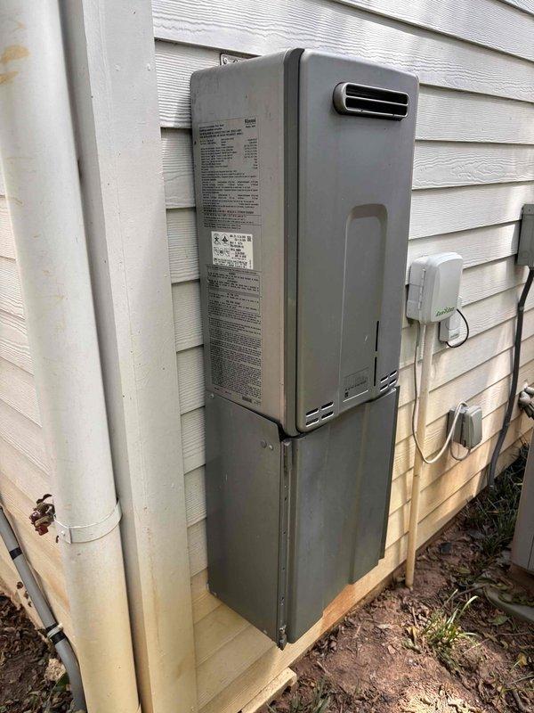 Completed sewer scope and inspection for Go After 2 service call. Documented exterior utility installations including tankless water heater mounting, PVC plumbing connections, and electrical components along building perimeter. Captured site conditions and work area setup for service records. Completed sewer scope and inspection for Go After 2 service call. Documented exterior utility installations including tankless water heater mounting, PVC plumbing connections, and electrical components along building perimeter. Captured site conditions and work area setup for service records.