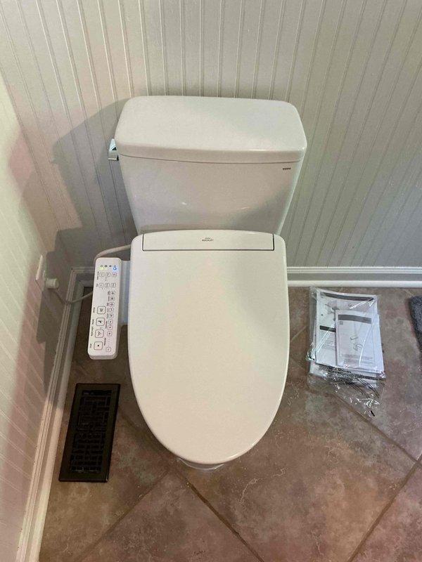 Completed installation of toilet with integrated bidet system, including final connections of water supply lines and drainage. Verified proper operation of electronic bidet controls and ensured all plumbing connections were secure and leak-free. Completed installation of toilet with integrated bidet system, including final connections of water supply lines and drainage. Verified proper operation of electronic bidet controls and ensured all plumbing connections were secure and leak-free.