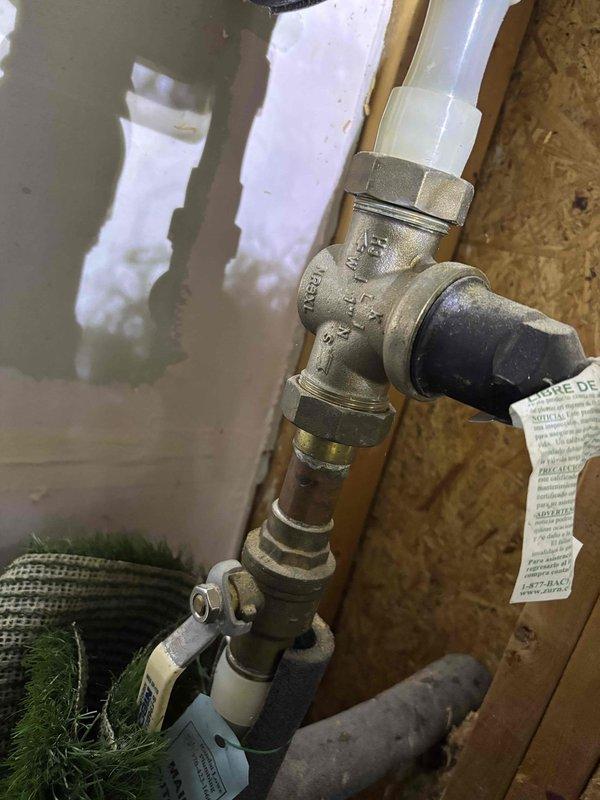 Responded to service call for InstaHot unit experiencing beeping alarm and no hot water production. Upon inspection, found control board displaying error code 195 on digital readout. Accessed internal cabinet to examine VCFF NG control board and associated electrical connections. Inspected all wire harnesses, terminals, and safety circuits for proper operation. Evaluated upstream plumbing connections including copper supply lines, brass valve assembly, and associated PEX connections at water inlet. Diagnosed issue, documented system configuration with photographs, and assessed control board functionality and water flow path to determine cause of alarm condition and loss of hot water delivery. Responded to service call for InstaHot unit experiencing beeping alarm and no hot water production. Upon inspection, found control board displaying error code 195 on digital readout. Accessed internal cabinet to examine VCFF NG control board and associated electrical connections. Inspected all wire harnesses, terminals, and safety circuits for proper operation. Evaluated upstream plumbing connections including copper supply lines, brass valve assembly, and associated PEX connections at water inlet. Diagnosed issue, documented system configuration with photographs, and assessed control board functionality and water flow path to determine cause of alarm condition and loss of hot water delivery.