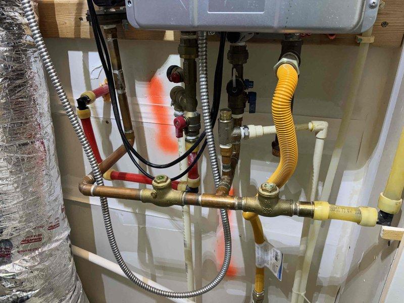 Responded to service call for tankless water heater experiencing audible alarm and loss of hot water output. Upon inspection, performed diagnostic evaluation of unit and associated plumbing connections, gas supply lines, electrical components, and venting system. Completed tankless water heater flush procedure to remove mineral buildup and scale deposits from heat exchanger, which was causing reduced flow and triggering error condition. Verified proper operation of all shutoff valves, gas line connections, and electrical controls. System tested and restored to normal operation with hot water delivery confirmed. Responded to service call for tankless water heater experiencing audible alarm and loss of hot water output. Upon inspection, performed diagnostic evaluation of unit and associated plumbing connections, gas supply lines, electrical components, and venting system. Completed tankless water heater flush procedure to remove mineral buildup and scale deposits from heat exchanger, which was causing reduced flow and triggering error condition. Verified proper operation of all shutoff valves, gas line connections, and electrical controls. System tested and restored to normal operation with hot water delivery confirmed.