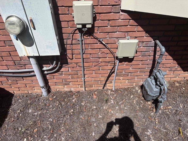 Responded to service call for sump pump system inspection and maintenance. Upon arrival, evaluated exterior electrical service connections and interior plumbing components associated with the sump pump installation. Inspected pressure gauge readings on copper piping system, verified proper operation of pump controls, and assessed condition of electrical wiring and junction boxes. Documented existing infrastructure including weathered conduit, aged copper piping with surface patina, and utility connections. System found operational with all components functioning within normal parameters. Responded to service call for sump pump system inspection and maintenance. Upon arrival, evaluated exterior electrical service connections and interior plumbing components associated with the sump pump installation. Inspected pressure gauge readings on copper piping system, verified proper operation of pump controls, and assessed condition of electrical wiring and junction boxes. Documented existing infrastructure including weathered conduit, aged copper piping with surface patina, and utility connections. System found operational with all components functioning within normal parameters.