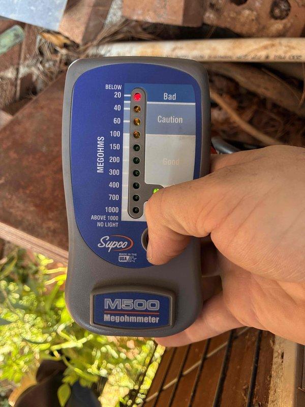 # No A/C Service Call
Responded to customer complaint of air handler running but no cooling. Upon arrival, performed diagnostic testing of the HVAC system located in crawlspace. Conducted insulation resistance testing on compressor windings using megohmmeter, which indicated readings in acceptable range within the "Good" zone. Inspected air handler plenum and ductwork for proper airflow and system integrity. Equipment showed signs of age with surface rust and dust accumulation but structural components remained intact. Verified electrical connections at junction box and assessed overall system condition. Determined compressor motor insulation resistance was within manufacturer specifications, ruling out compressor failure as cause of cooling loss. # No A/C Service Call
Responded to customer complaint of air handler running but no cooling. Upon arrival, performed diagnostic testing of the HVAC system located in crawlspace. Conducted insulation resistance testing on compressor windings using megohmmeter, which indicated readings in acceptable range within the "Good" zone. Inspected air handler plenum and ductwork for proper airflow and system integrity. Equipment showed signs of age with surface rust and dust accumulation but structural components remained intact. Verified electrical connections at junction box and assessed overall system condition. Determined compressor motor insulation resistance was within manufacturer specifications, ruling out compressor failure as cause of cooling loss.