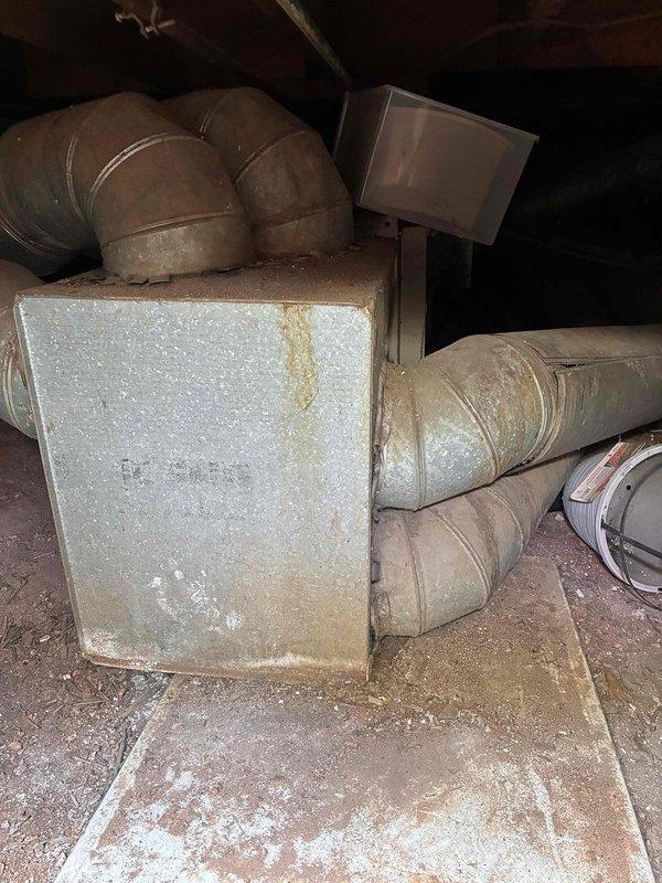 # No A/C Service Call
Responded to customer complaint of air handler running but no cooling. Upon arrival, performed diagnostic testing of the HVAC system located in crawlspace. Conducted insulation resistance testing on compressor windings using megohmmeter, which indicated readings in acceptable range within the "Good" zone. Inspected air handler plenum and ductwork for proper airflow and system integrity. Equipment showed signs of age with surface rust and dust accumulation but structural components remained intact. Verified electrical connections at junction box and assessed overall system condition. Determined compressor motor insulation resistance was within manufacturer specifications, ruling out compressor failure as cause of cooling loss. # No A/C Service Call
Responded to customer complaint of air handler running but no cooling. Upon arrival, performed diagnostic testing of the HVAC system located in crawlspace. Conducted insulation resistance testing on compressor windings using megohmmeter, which indicated readings in acceptable range within the "Good" zone. Inspected air handler plenum and ductwork for proper airflow and system integrity. Equipment showed signs of age with surface rust and dust accumulation but structural components remained intact. Verified electrical connections at junction box and assessed overall system condition. Determined compressor motor insulation resistance was within manufacturer specifications, ruling out compressor failure as cause of cooling loss.