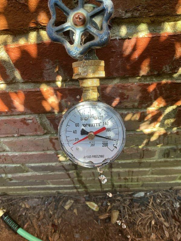Responded to emergency call for high water pressure surge causing refrigerator icemaker line failure and leak. Upon arrival, confirmed water supply had been shut off to prevent further damage. Conducted comprehensive pressure testing at exterior hose bib and water heater connection points using calibrated pressure gauges. Readings indicated system pressure approximately 80 PSI, which falls within acceptable range but may experience initial surge conditions due to pressure regulator malfunction or water hammer effect. Documented pressure conditions with photographic evidence showing gauge readings at multiple test locations. Identified need for pressure reducing valve inspection or replacement to eliminate initial surge phenomenon that caused line failure. Recommended installation of water hammer arrestor if not currently present in system to prevent future pressure spikes when fixtures are opened rapidly. Responded to emergency call for high water pressure surge causing refrigerator icemaker line failure and leak. Upon arrival, confirmed water supply had been shut off to prevent further damage. Conducted comprehensive pressure testing at exterior hose bib and water heater connection points using calibrated pressure gauges. Readings indicated system pressure approximately 80 PSI, which falls within acceptable range but may experience initial surge conditions due to pressure regulator malfunction or water hammer effect. Documented pressure conditions with photographic evidence showing gauge readings at multiple test locations. Identified need for pressure reducing valve inspection or replacement to eliminate initial surge phenomenon that caused line failure. Recommended installation of water hammer arrestor if not currently present in system to prevent future pressure spikes when fixtures are opened rapidly.