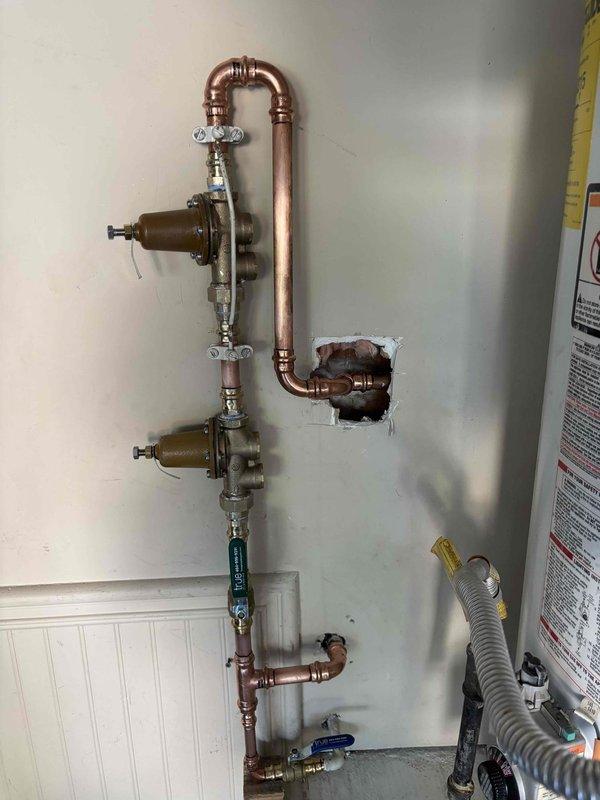 Replaced high-pressure water regulator on main supply line. Installed new brass pressure-reducing valve with copper piping connections, ensuring proper water pressure regulation throughout the building. System tested and verified operational with no leaks detected. Replaced high-pressure water regulator on main supply line. Installed new brass pressure-reducing valve with copper piping connections, ensuring proper water pressure regulation throughout the building. System tested and verified operational with no leaks detected.