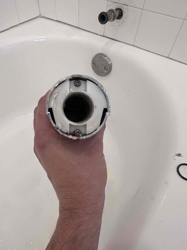 Completed bathroom plumbing repair involving Delta shower fixture installation. Addressed exposed pipe stub with blue threaded adapter connection through tiled wall, securing proper fit for shower assembly. Inspected and verified bathtub drain assembly functionality, including chrome overflow cover plate and mounting hardware. All plumbing connections tested and confirmed operational upon completion. Completed bathroom plumbing repair involving Delta shower fixture installation. Addressed exposed pipe stub with blue threaded adapter connection through tiled wall, securing proper fit for shower assembly. Inspected and verified bathtub drain assembly functionality, including chrome overflow cover plate and mounting hardware. All plumbing connections tested and confirmed operational upon completion.