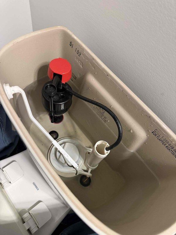 Responded to high water bill concern following leak detection recommendation. Inspected toilet tank and fill valve assembly for potential leaks or malfunction. Checked water pressure and assessed condition of internal toilet components including fill valve, flush valve, and connecting hardware. Documented tank interior showing fill valve assembly with adjustment collar and all plumbing mechanisms for diagnostic purposes. Responded to high water bill concern following leak detection recommendation. Inspected toilet tank and fill valve assembly for potential leaks or malfunction. Checked water pressure and assessed condition of internal toilet components including fill valve, flush valve, and connecting hardware. Documented tank interior showing fill valve assembly with adjustment collar and all plumbing mechanisms for diagnostic purposes.