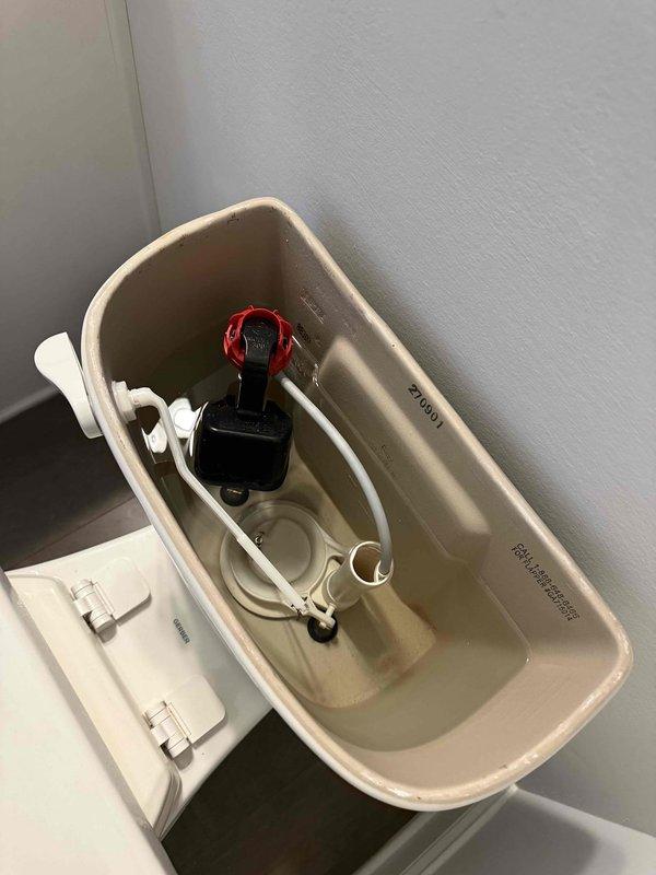 Responded to high water bill concern following leak detection recommendation. Inspected toilet tank and fill valve assembly for potential leaks or malfunction. Checked water pressure and assessed condition of internal toilet components including fill valve, flush valve, and connecting hardware. Documented tank interior showing fill valve assembly with adjustment collar and all plumbing mechanisms for diagnostic purposes. Responded to high water bill concern following leak detection recommendation. Inspected toilet tank and fill valve assembly for potential leaks or malfunction. Checked water pressure and assessed condition of internal toilet components including fill valve, flush valve, and connecting hardware. Documented tank interior showing fill valve assembly with adjustment collar and all plumbing mechanisms for diagnostic purposes.