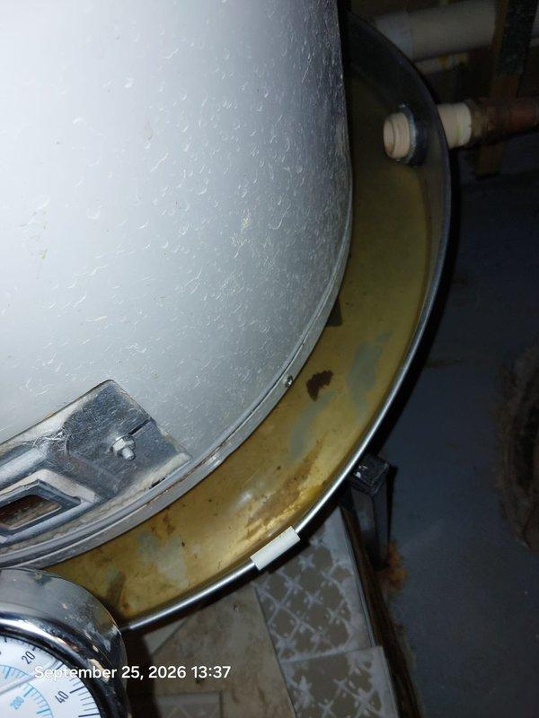 Responded to service call for non-operational water heater. Upon inspection, identified excessive corrosion on tank insulation jacket and concerning moisture accumulation on exterior surfaces indicating potential tank failure. Pressure gauge reading showed system was operating within normal parameters at time of inspection. Documented equipment condition with photos showing advanced deterioration of tank components and recommended immediate replacement due to compromised tank integrity and high risk of catastrophic failure. Responded to service call for non-operational water heater. Upon inspection, identified excessive corrosion on tank insulation jacket and concerning moisture accumulation on exterior surfaces indicating potential tank failure. Pressure gauge reading showed system was operating within normal parameters at time of inspection. Documented equipment condition with photos showing advanced deterioration of tank components and recommended immediate replacement due to compromised tank integrity and high risk of catastrophic failure.