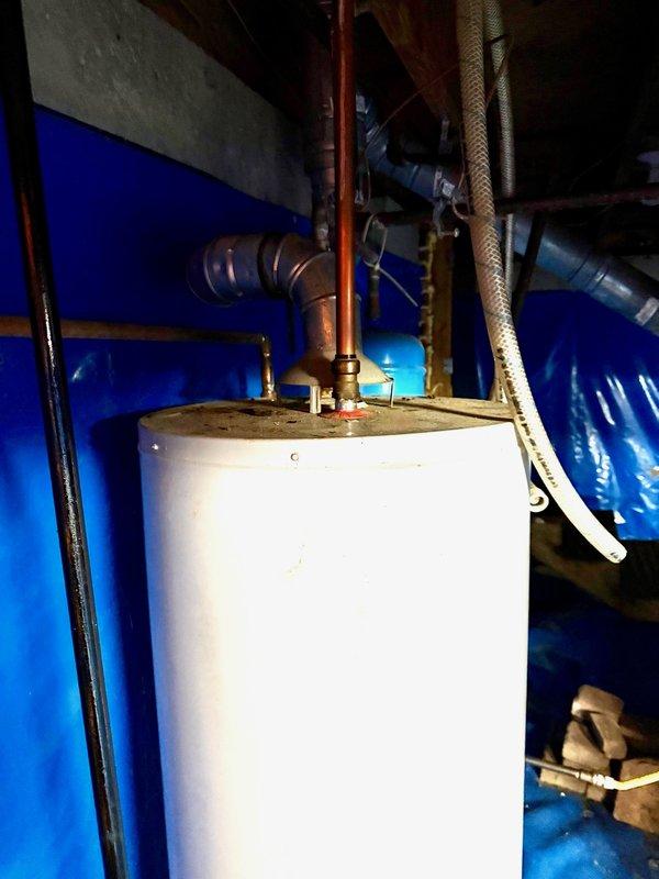 Responded to service call for 11-year-old 40-gallon gas water heater with no hot water production. Upon inspection, discovered heavily corroded copper piping and evidence of water leakage at base of unit, indicating tank failure. Removed and disposed of failed water heater. Installed new 40-gallon gas water heater with fresh copper connections, gas control valve, and proper venting. Tested all connections for leaks, verified gas supply operation, and confirmed hot water delivery to fixtures throughout property. Responded to service call for 11-year-old 40-gallon gas water heater with no hot water production. Upon inspection, discovered heavily corroded copper piping and evidence of water leakage at base of unit, indicating tank failure. Removed and disposed of failed water heater. Installed new 40-gallon gas water heater with fresh copper connections, gas control valve, and proper venting. Tested all connections for leaks, verified gas supply operation, and confirmed hot water delivery to fixtures throughout property.