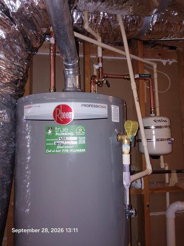 Completed replacement of 50-gallon Rheem Professional series residential water heater in basement utility area. Removed existing unit and installed new water heater with proper copper supply line connections, PVC venting system, brass shutoff valves, and Flexcon expansion tank. All plumbing connections secured with appropriate fittings and materials per manufacturer specifications and local code requirements. Completed replacement of 50-gallon Rheem Professional series residential water heater in basement utility area. Removed existing unit and installed new water heater with proper copper supply line connections, PVC venting system, brass shutoff valves, and Flexcon expansion tank. All plumbing connections secured with appropriate fittings and materials per manufacturer specifications and local code requirements.