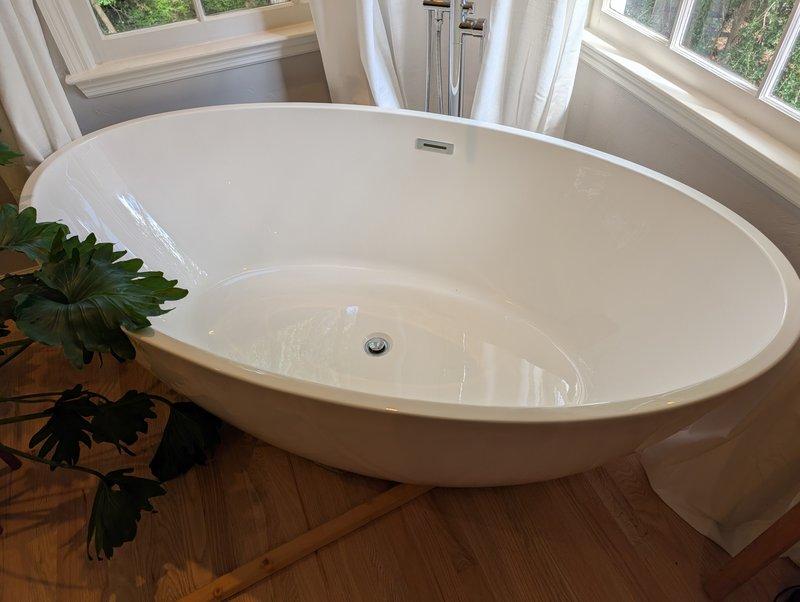 Responded to plumbing repair request for leaking freestanding bathtub drain assembly. Upon arrival, confirmed water leakage from drain onto floor beneath the tub. Accessed the drain assembly by repositioning the freestanding tub, which provided adequate working clearance. Inspected the drain connection and determined the drain assembly was improperly installed, causing the leak. Disassembled the existing drain components, cleaned and prepared all connection surfaces, and reinstalled the drain assembly with proper sealing and torque specifications. Verified all connections were secure and watertight. Tested the drain system by filling the tub and allowing it to drain completely while inspecting for any signs of leakage. Confirmed repair was successful with no water escaping from the drain assembly. Repositioned tub to original location and left work area clean. Responded to plumbing repair request for leaking freestanding bathtub drain assembly. Upon arrival, confirmed water leakage from drain onto floor beneath the tub. Accessed the drain assembly by repositioning the freestanding tub, which provided adequate working clearance. Inspected the drain connection and determined the drain assembly was improperly installed, causing the leak. Disassembled the existing drain components, cleaned and prepared all connection surfaces, and reinstalled the drain assembly with proper sealing and torque specifications. Verified all connections were secure and watertight. Tested the drain system by filling the tub and allowing it to drain completely while inspecting for any signs of leakage. Confirmed repair was successful with no water escaping from the drain assembly. Repositioned tub to original location and left work area clean.