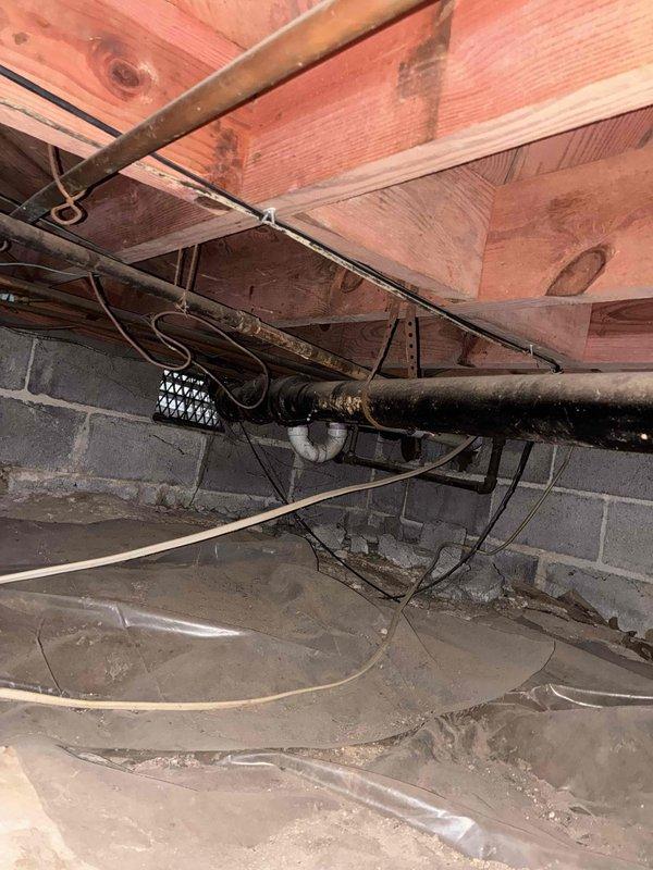 Responded to plumbing leak in washing machine drain piping located in crawl space. Upon inspection, identified failed connection at drain line causing water discharge into subfloor area. Repaired leaking pipe joint and tested system to verify proper drainage and seal integrity. Additionally replaced malfunctioning kitchen sink sprayer assembly with new unit and confirmed proper operation of spray function and hose retraction. Responded to plumbing leak in washing machine drain piping located in crawl space. Upon inspection, identified failed connection at drain line causing water discharge into subfloor area. Repaired leaking pipe joint and tested system to verify proper drainage and seal integrity. Additionally replaced malfunctioning kitchen sink sprayer assembly with new unit and confirmed proper operation of spray function and hose retraction.
