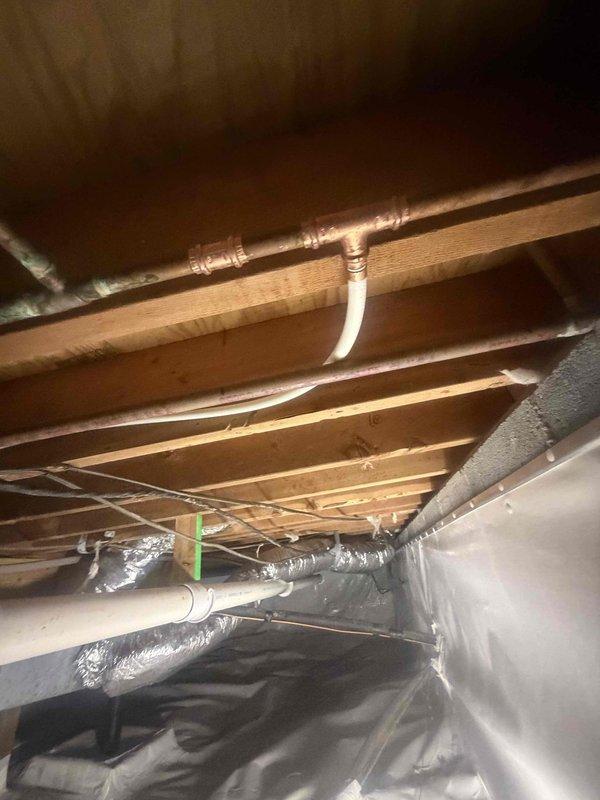 Responded to a leak on the refrigerator icemaker supply line located in the crawl space. Upon inspection, identified active leak occurring on the copper water line upstream of the shut off valve. Repaired the compromised section of copper piping, verified all connections were secure, and confirmed system was leak-free before restoring water supply to the icemaker. Responded to a leak on the refrigerator icemaker supply line located in the crawl space. Upon inspection, identified active leak occurring on the copper water line upstream of the shut off valve. Repaired the compromised section of copper piping, verified all connections were secure, and confirmed system was leak-free before restoring water supply to the icemaker.