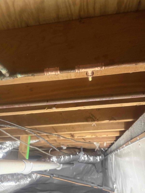 Responded to a leak on the refrigerator icemaker supply line located in the crawl space. Upon inspection, identified active leak occurring on the copper water line upstream of the shut off valve. Repaired the compromised section of copper piping, verified all connections were secure, and confirmed system was leak-free before restoring water supply to the icemaker. Responded to a leak on the refrigerator icemaker supply line located in the crawl space. Upon inspection, identified active leak occurring on the copper water line upstream of the shut off valve. Repaired the compromised section of copper piping, verified all connections were secure, and confirmed system was leak-free before restoring water supply to the icemaker.