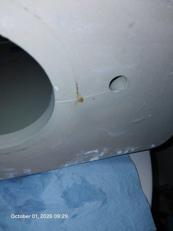 Performed follow-up inspection on malfunctioning toilet. Documented internal tank components including flush valve assembly, dual red rubber flappers, chain mechanism, and fill valve showing signs of mineral deposits and wear. Issue remains unresolved and requires further diagnostic work or component replacement to restore proper flushing function. Performed follow-up inspection on malfunctioning toilet. Documented internal tank components including flush valve assembly, dual red rubber flappers, chain mechanism, and fill valve showing signs of mineral deposits and wear. Issue remains unresolved and requires further diagnostic work or component replacement to restore proper flushing function.