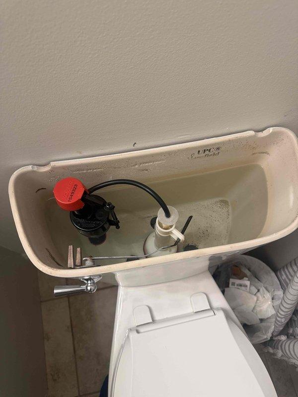 Responded to toilet leaking at base. Upon inspection, removed tank lid and examined internal components including flush valve assembly and fill valve. Inspected wax ring seal at toilet base and water supply connections. Verified system pressure at approximately 50-60 PSI using pressure gauge. Documented existing mineral deposits and tank condition, then proceeded with necessary repairs to eliminate leak at base. Responded to toilet leaking at base. Upon inspection, removed tank lid and examined internal components including flush valve assembly and fill valve. Inspected wax ring seal at toilet base and water supply connections. Verified system pressure at approximately 50-60 PSI using pressure gauge. Documented existing mineral deposits and tank condition, then proceeded with necessary repairs to eliminate leak at base.