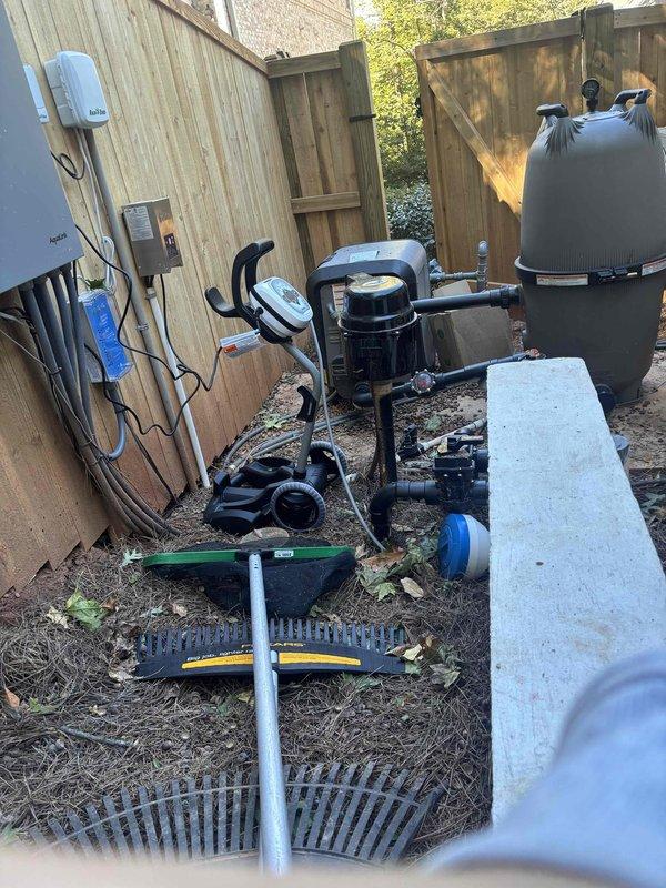Evaluated the installation of an outdoor shower at the new pool adjacent to the carriage house. Surveyed the pool equipment pad and side yard, documenting the existing filter, heater, pump, Aqualink control panel, and electrical conduit, and identified accessible routes for potable water supply and drain lines to the proposed shower location. Noted site conditions, including construction debris and tight clearances along the fence, to be addressed prior to installation. Evaluated the installation of an outdoor shower at the new pool adjacent to the carriage house. Surveyed the pool equipment pad and side yard, documenting the existing filter, heater, pump, Aqualink control panel, and electrical conduit, and identified accessible routes for potable water supply and drain lines to the proposed shower location. Noted site conditions, including construction debris and tight clearances along the fence, to be addressed prior to installation.
