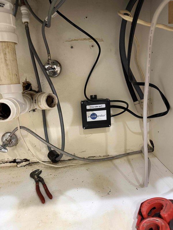 Completed multiple plumbing tasks per the approved scope, including installation of the customer-supplied kitchen faucet. Worked within the under-sink cabinet to service the double-basin P-trap drain assembly, garbage disposal connection, and chrome angle stop valves with braided supply lines, verifying secure slip-joint connections and proper operation. Noted staining and discoloration on the PVC drain piping and cabinet floor consistent with prior moisture exposure, and confirmed no active leaks at completion. Completed multiple plumbing tasks per the approved scope, including installation of the customer-supplied kitchen faucet. Worked within the under-sink cabinet to service the double-basin P-trap drain assembly, garbage disposal connection, and chrome angle stop valves with braided supply lines, verifying secure slip-joint connections and proper operation. Noted staining and discoloration on the PVC drain piping and cabinet floor consistent with prior moisture exposure, and confirmed no active leaks at completion.